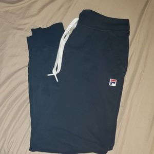Black Fila sweatpants.